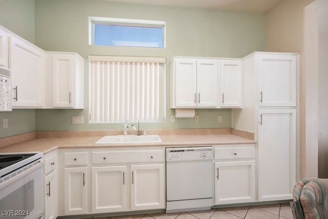 kitchen featuring sink, white cabinets, and white appliances