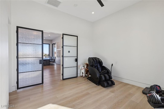 sitting room featuring light hardwood / wood-style floors