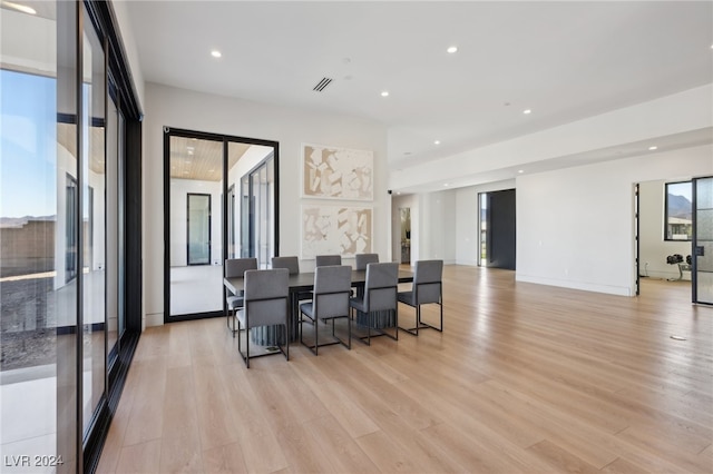 dining space with light hardwood / wood-style flooring