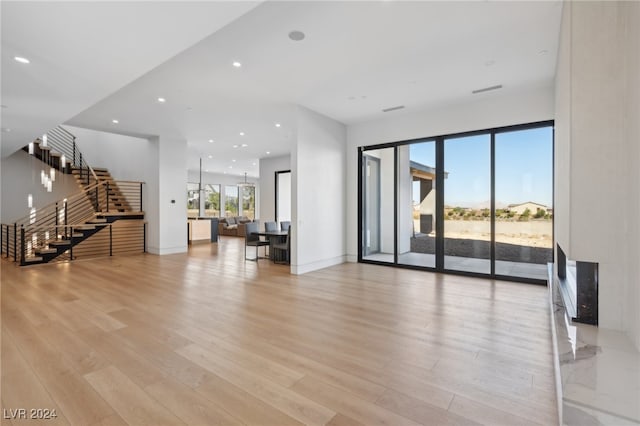 unfurnished living room with light wood-type flooring