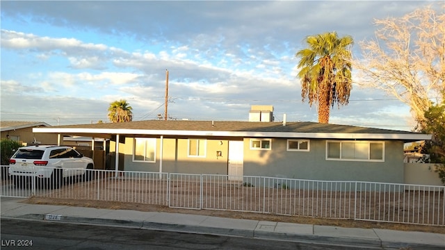 view of front of home with a carport