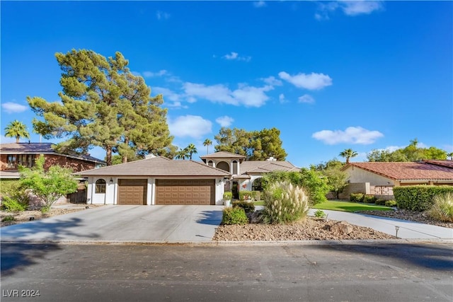 2504 Windjammer Way, Las Vegas, NV 89107 - view of front of house featuring a garage and driveway