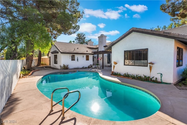 view of pool featuring a patio area