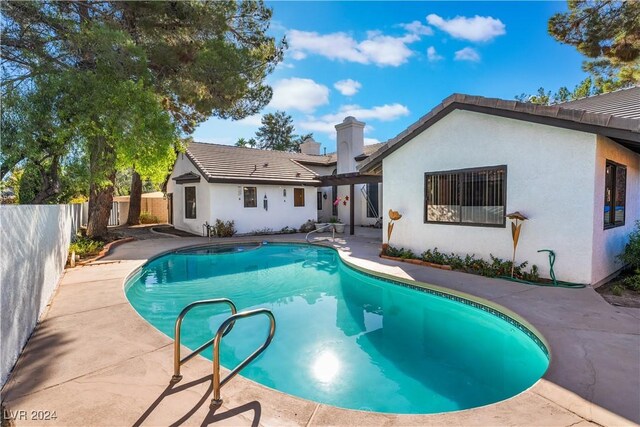 2504 Windjammer Way, Las Vegas, NV 89107 - view of swimming pool featuring a fenced backyard, a patio area, and a pergola
