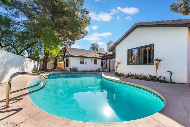 view of swimming pool with a patio