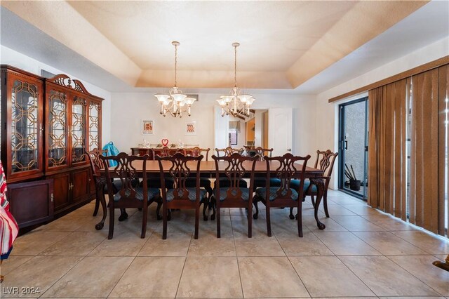 2504 Windjammer Way, Las Vegas, NV 89107 - dining room featuring a raised ceiling, a chandelier, and light tile patterned floors