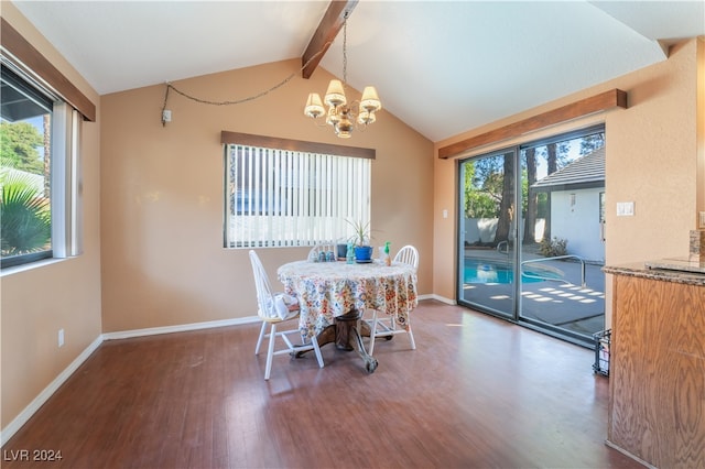 dining space featuring a wealth of natural light, dark wood-type flooring, lofted ceiling with beams, and a notable chandelier