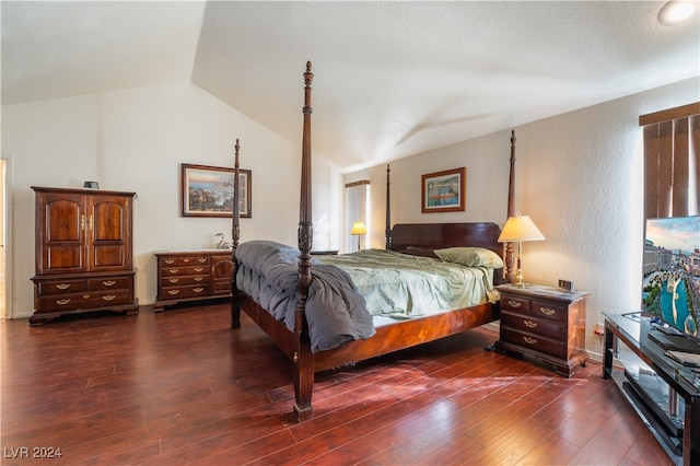 bedroom featuring dark hardwood / wood-style floors and vaulted ceiling