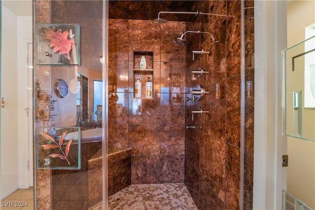 bathroom with a tile shower