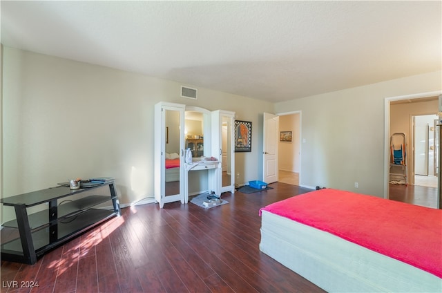 bedroom featuring dark wood-type flooring