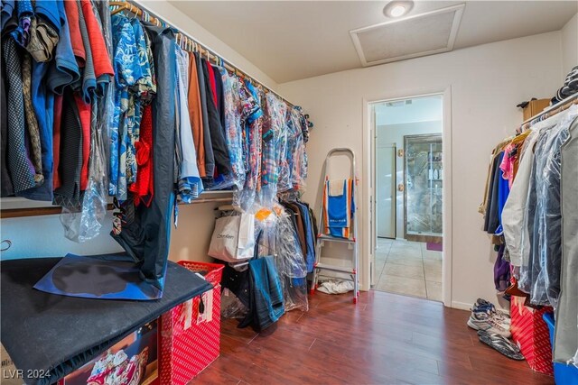 2504 Windjammer Way, Las Vegas, NV 89107 - spacious closet with attic access and wood finished floors