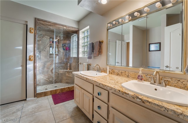 bathroom featuring vanity, walk in shower, and tile patterned flooring