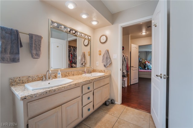 bathroom with vanity and hardwood / wood-style flooring