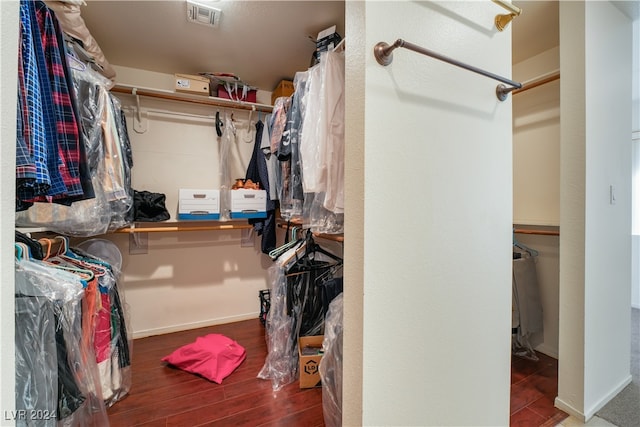 walk in closet featuring dark hardwood / wood-style flooring