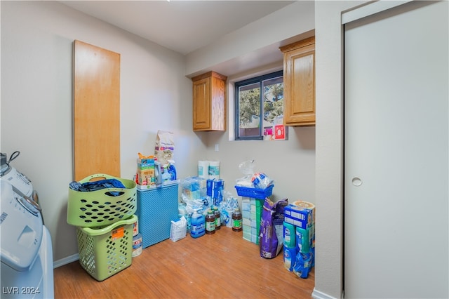 washroom with cabinets and wood-type flooring