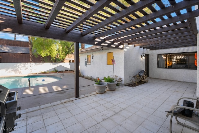 view of patio / terrace with a fenced in pool and a pergola