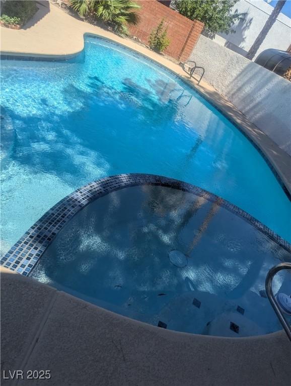 2504 Windjammer Way, Las Vegas, NV 89107 - view of swimming pool with a pool with connected hot tub
