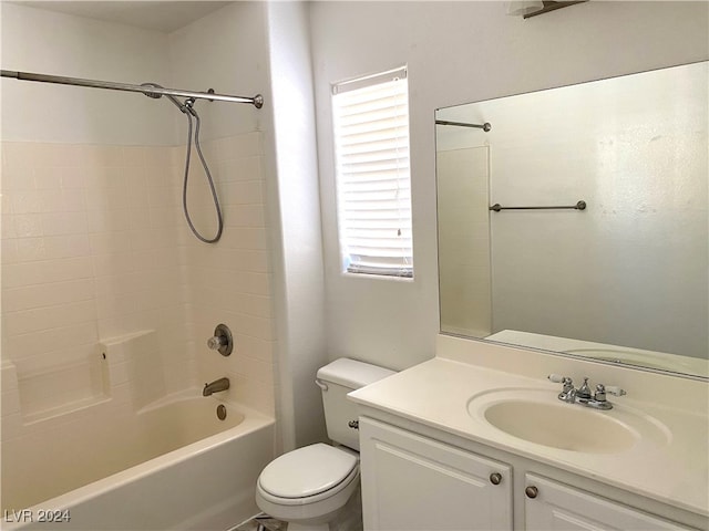 full bathroom with vanity, toilet, and tiled shower / bath