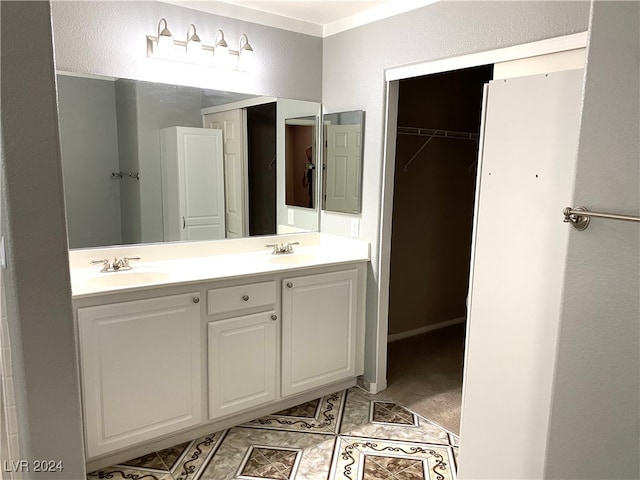 bathroom featuring vanity, ornamental molding, and tile patterned floors