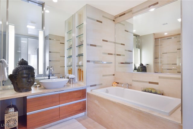 bathroom featuring vanity, separate shower and tub, and tile walls