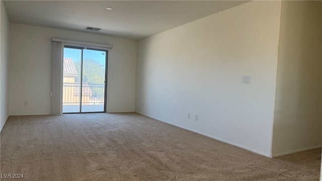 spare room with light colored carpet