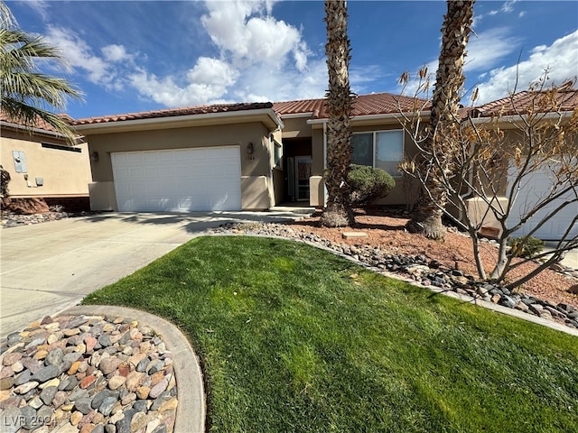 view of front of house featuring a garage and a front yard