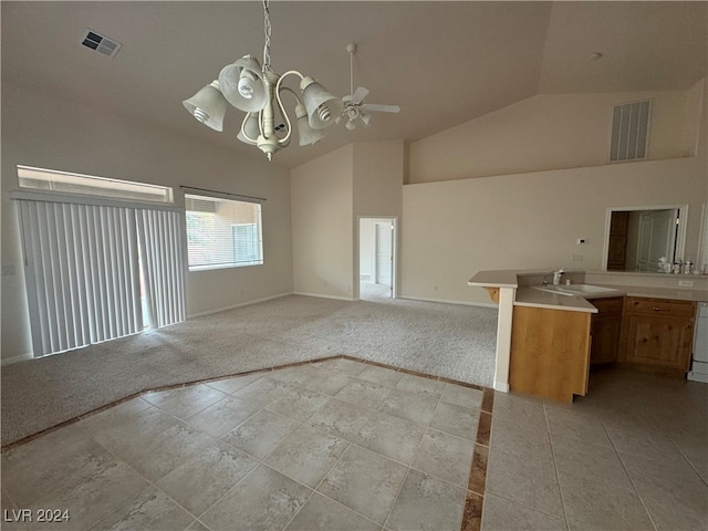 kitchen with high vaulted ceiling, sink, light carpet, and ceiling fan