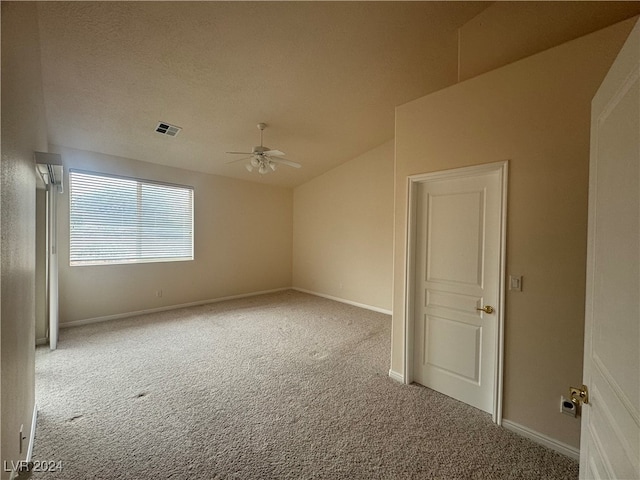 unfurnished room with ceiling fan and light carpet