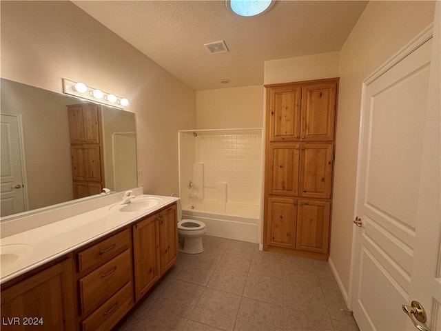 full bathroom featuring tile patterned flooring, a textured ceiling,  shower combination, vanity, and toilet