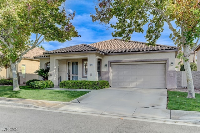 mediterranean / spanish-style home featuring a porch, a garage, and a front lawn