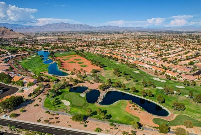aerial view with a water and mountain view, golf course view, and a residential view