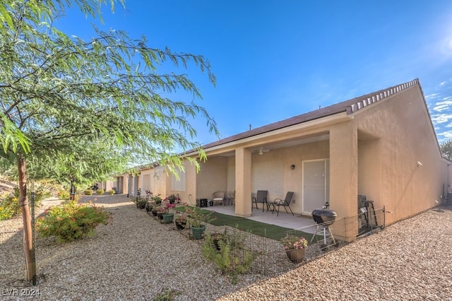 rear view of property with a patio area