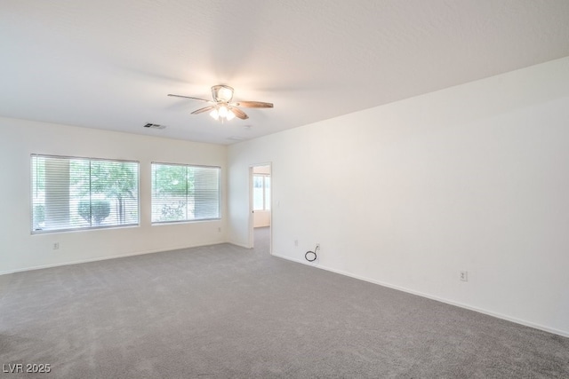 7625 Fieldfare Dr, North Las Vegas, NV 89084 - spare room featuring ceiling fan, carpet, and baseboards