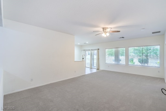 7625 Fieldfare Dr, North Las Vegas, NV 89084 - spare room featuring healthy amount of natural light, carpet, ceiling fan, and baseboards