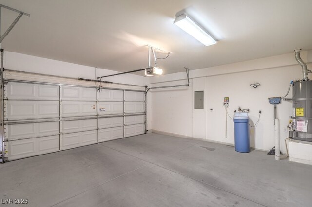 7625 Fieldfare Dr, North Las Vegas, NV 89084 - garage with electric panel, a garage door opener, and secured water heater
