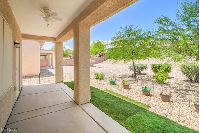 7625 Fieldfare Dr, North Las Vegas, NV 89084 - fenced backyard with ceiling fan and a patio