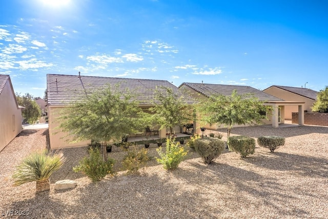 7625 Fieldfare Dr, North Las Vegas, NV 89084 - view of front of house with stucco siding and a tile roof