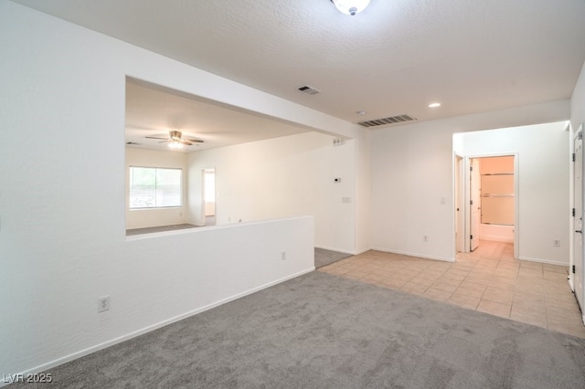7625 Fieldfare Dr, North Las Vegas, NV 89084 - carpeted empty room with baseboards, tile patterned floors, a ceiling fan, and recessed lighting