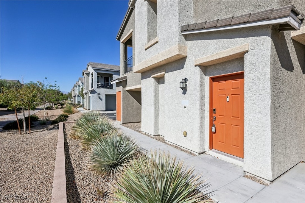 doorway to property with a garage