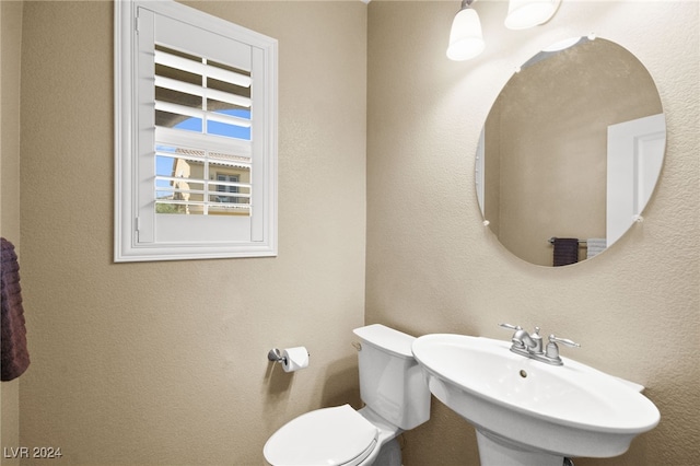 bathroom with sink and toilet