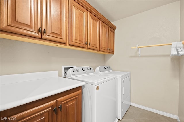 laundry room featuring cabinets and independent washer and dryer