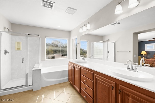 bathroom with plus walk in shower, vanity, tile patterned floors, and ceiling fan