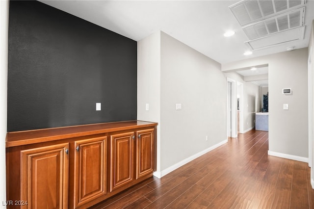 corridor featuring dark wood-type flooring