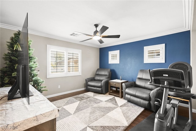 interior space featuring ceiling fan, hardwood / wood-style floors, and ornamental molding