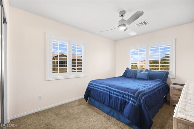 carpeted bedroom with ceiling fan