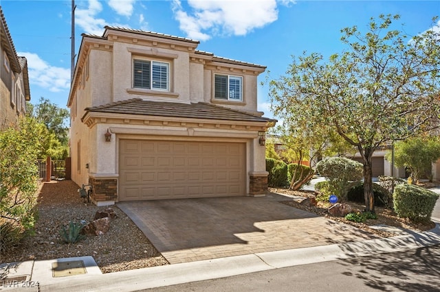 view of front of home with a garage