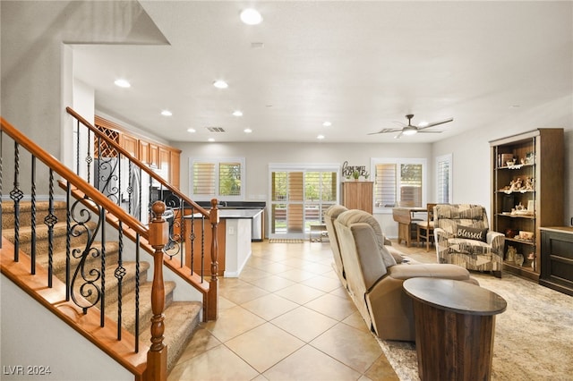 living room with ceiling fan and light tile patterned floors