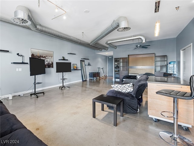 living room with concrete floors and ceiling fan