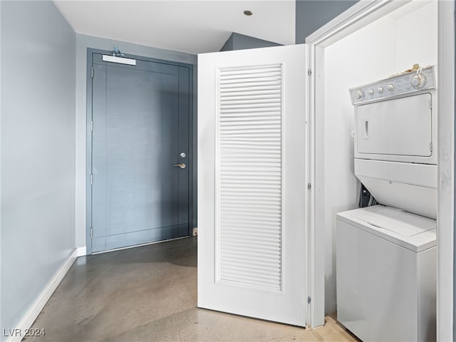 clothes washing area with stacked washer / drying machine