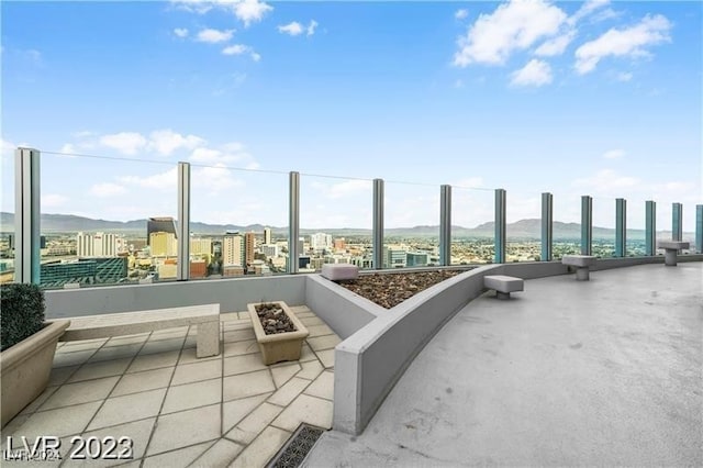 view of patio / terrace with a mountain view